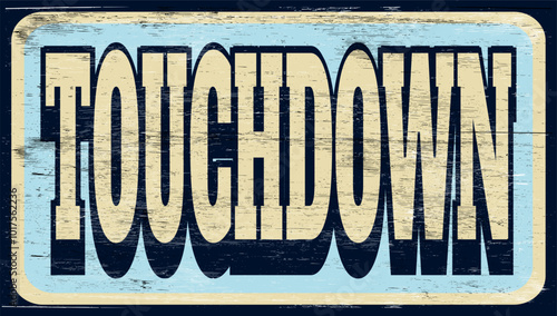 Aged vintage touchdown sign on wood