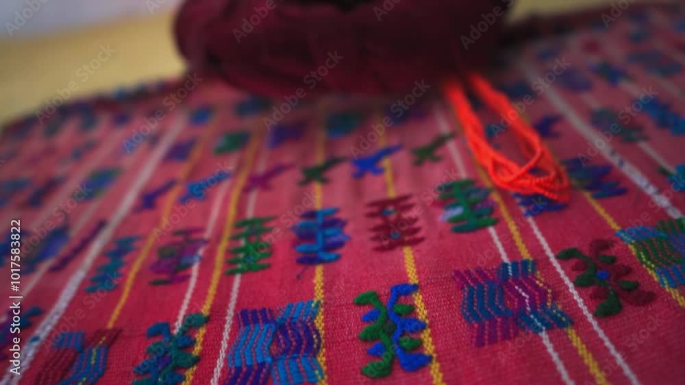 Close-up of a vibrant red traditional costume, adorned with intricate embroidery and cultural details. This costume highlights the rich heritage and tradition of regional clothing. Close-up of a vibrant red traditional costume, adorned with intricate embroidery and cultural details. This costume highlights the rich heritage and tradition of regional clothing.