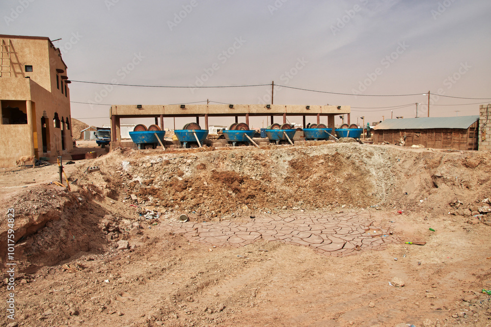 Nouakchott, Mauritania - 06 Jan 2022: Factory next to a gold mine in Sahara desert not far Nouakchott, Mauritania, West Africa