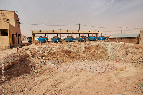 Obraz na płótnie Nouakchott, Mauritania - 06 Jan 2022: Factory next to a gold mine in Sahara desert not far Nouakchott, Mauritania, West Africa w salonie