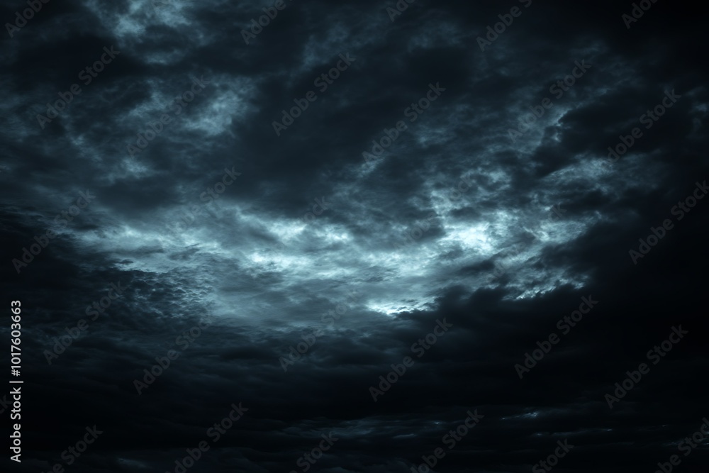 Dark, moody clouds create an atmospheric sky scene. Dark, moody clouds create an atmospheric sky scene.