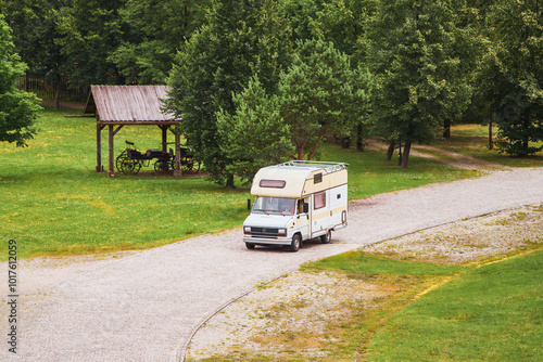 RV traveling scenic route by green countryside