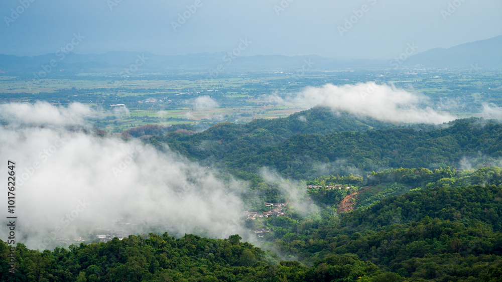Fototapeta premium Beautiful Mountain landscape foggy windy mountain range green landscape asian farm. Amazing Landscape mountain green field meadow white cloud blue sky on sunrise. Countryside sunlight heaven scenery