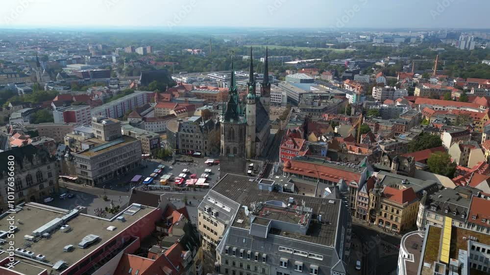 market square with the red tower and st. Mary's church in halle saale, germany. Amazing aerial view flight wide orbit overview drone market square with the red tower and st. Mary's church in halle saale, germany. Amazing aerial view flight wide orbit overview drone
