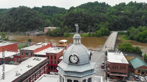 4K Aerial Drone Video of the Statue and Clock Tower on the Madison County Courthouse in Downtown Marshall, NC (2021) photo