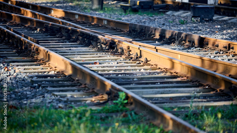 Large empty railroad crossing without fork. Concept of industrial logistic and transportation background with selective focus on intersection with copy space 16x9. Large empty railroad crossing without fork. Concept of industrial logistic and transportation background with selective focus on intersection with copy space 16x9.