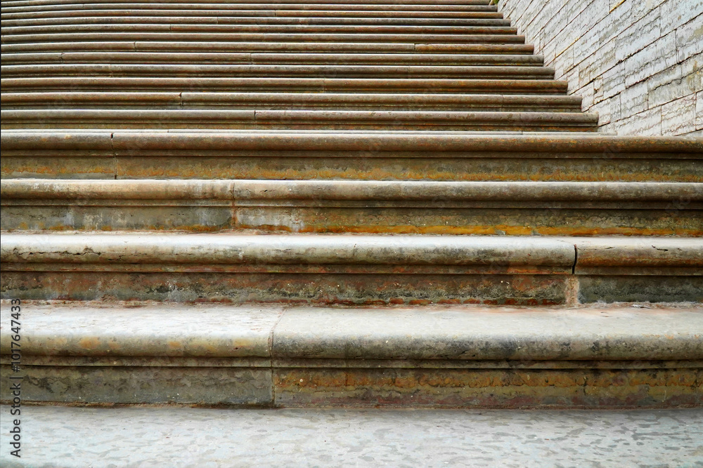 Fototapeta premium Steps in the sidewalk tile as a background .