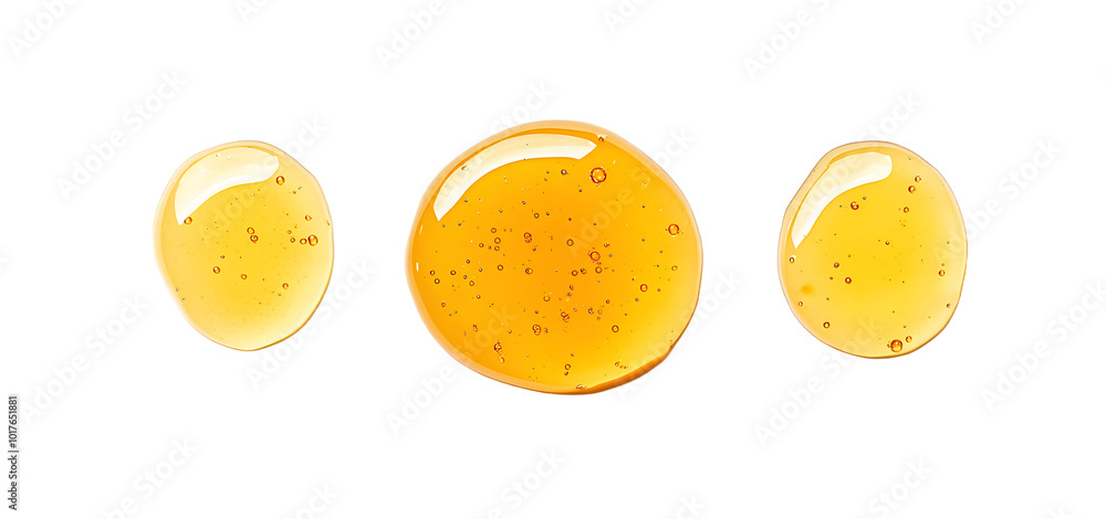 Fototapeta premium Honey droplets isolated on white, top view