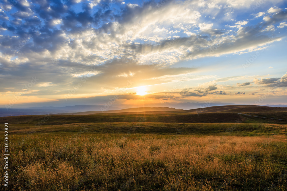 Yellow grassland and beautiful sky clouds nature landscape at sunset. Autumn landscape. Yellow grassland and beautiful sky clouds nature landscape at sunset. Autumn landscape.