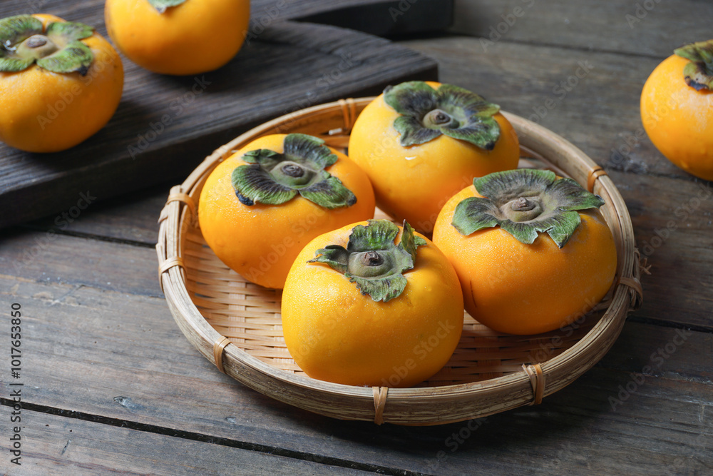 Persimmon fruit of trees in the genus Diospyros Persimmon fruit of trees in the genus Diospyros