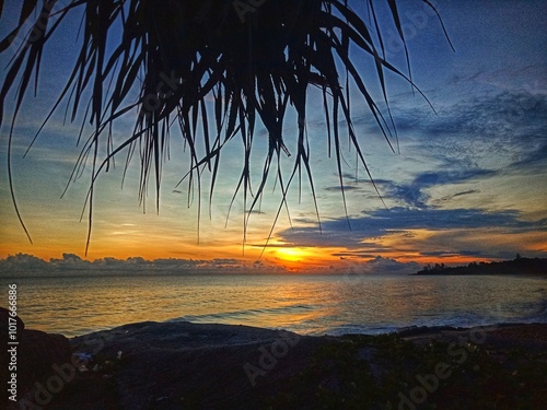 A very beautiful sunrise at the Tikus Emas Beach, Bangka Belitung photo