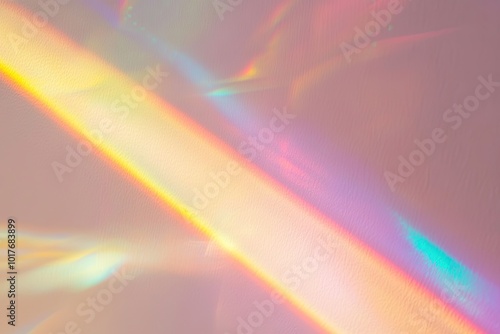 Rainbow light shines on a pink wall. Perfect for adding a dreamy, ethereal feel to your design.