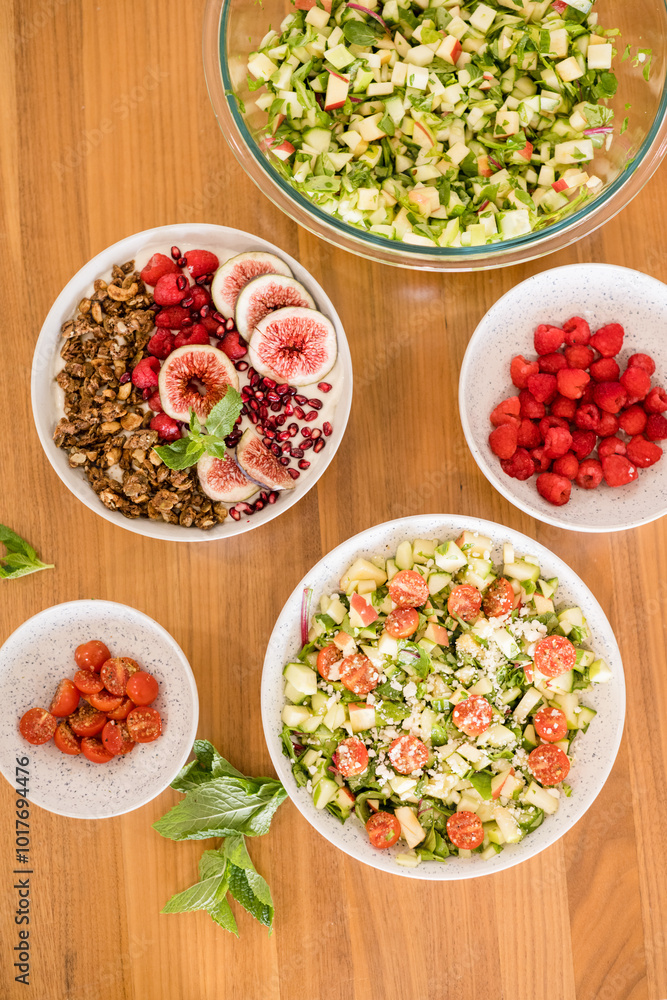 Bowls with fruit, salad, and yogurt Bowls with fruit, salad, and yogurt