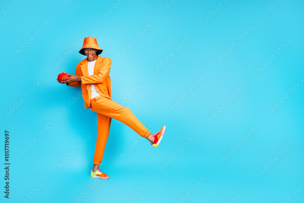 Photo of excited funky guy hold pumpkin vegetable for halloween moving isolated blue color background Photo of excited funky guy hold pumpkin vegetable for halloween moving isolated blue color background