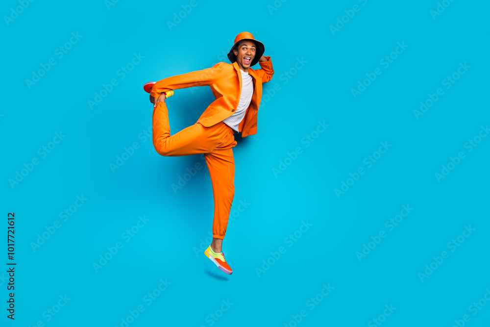 Obraz premium Full length photo of positive gut jumping moving touch legs wear stylish outfit isolated cyan color background
