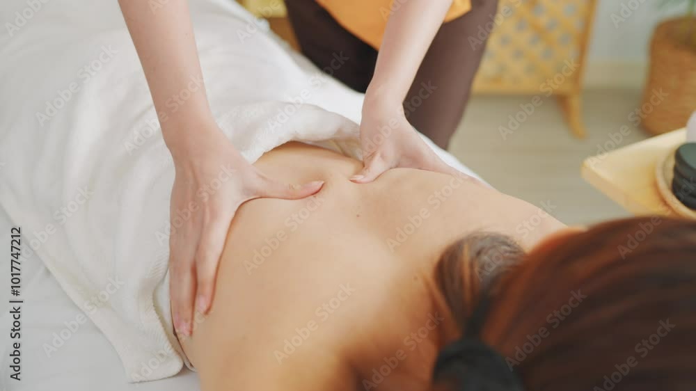 Asian young woman getting back massage treatment with oil at beauty spa. Asian young woman getting back massage treatment with oil at beauty spa.