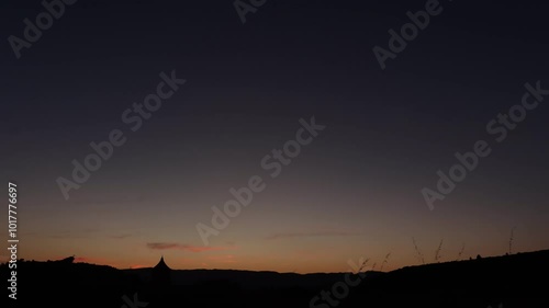 Wallpaper Mural Serene Sunset with Silhouetted Hills and Church Tower 4k video Torontodigital.ca