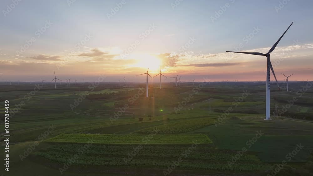 view of wind power station in field at sunset view of wind power station in field at sunset