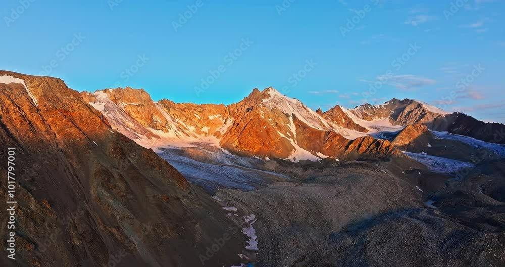 Aerial view of spectacular mountain and glaciers natural landscape at sunrise. Beautiful mountain peaks scenery in Xinjiang, China. Aerial view of spectacular mountain and glaciers natural landscape at sunrise. Beautiful mountain peaks scenery in Xinjiang, China.
