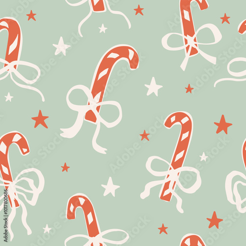 Seamless pattern with Cute doodle candy canes with bows.  Hand drawn vector illustration. Naive coquette core design. Funny Christmas background, wrapping paper.