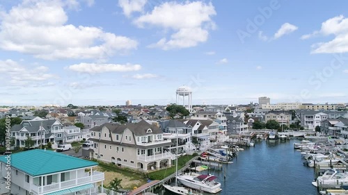 Ocean City New Jersey water tower, bay, boats and vacation homes aerial on a summer day photo