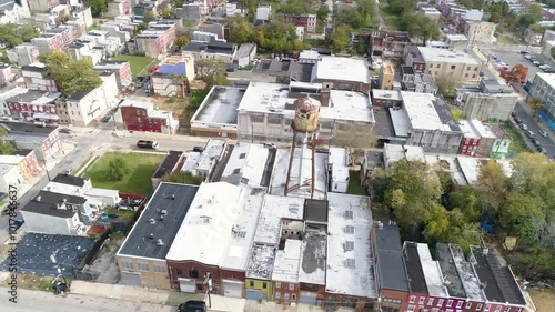 Aerial of a water tower in North Philly surrounded by buildings and row homes photo