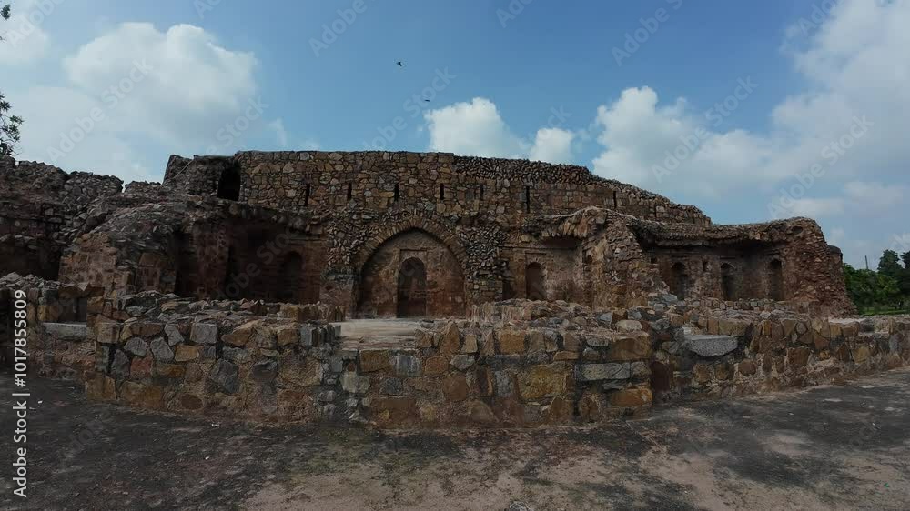 medieval structure amidst lush greenery at Feroz shah kotla fort, Delhi, India medieval structure amidst lush greenery at Feroz shah kotla fort, Delhi, India