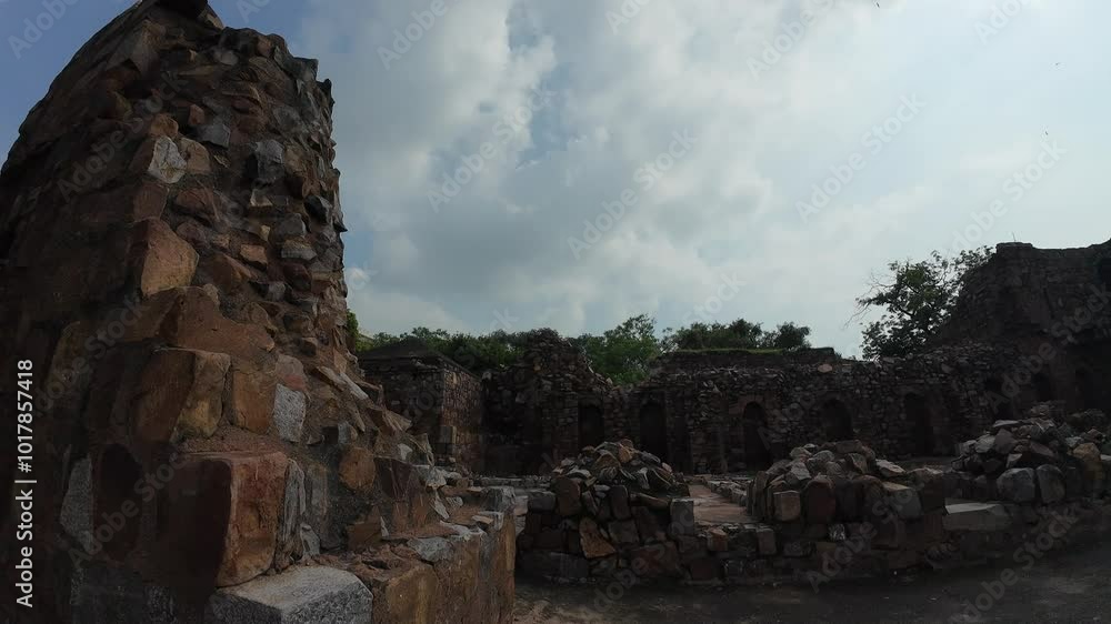 medieval structure amidst lush greenery at Feroz shah kotla fort, Delhi, India
