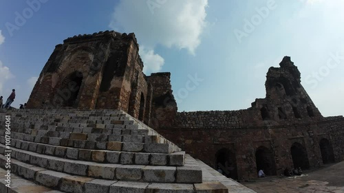 medieval structure amidst lush greenery at Feroz shah kotla fort, Delhi, India photo