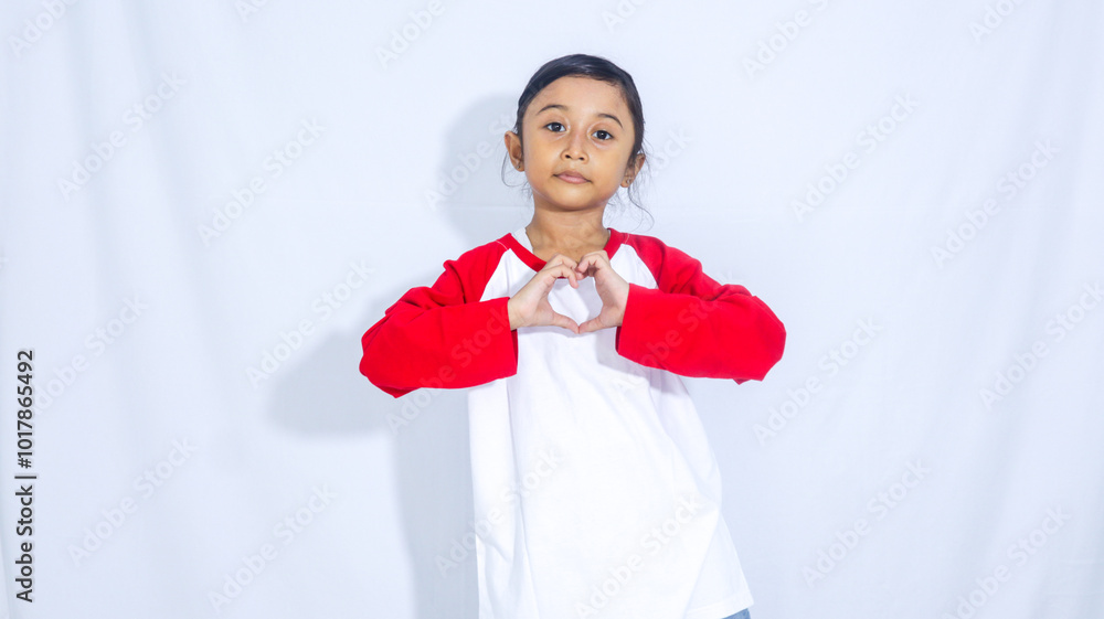 Asian Indonesian kid child little girl pose love and heart isolated on white background Asian Indonesian kid child little girl pose love and heart isolated on white background