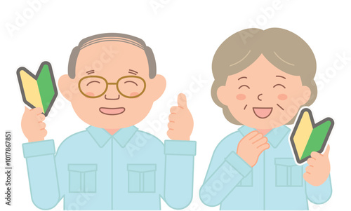 初心者マークを手に持って笑う作業着のシニアスタッフ