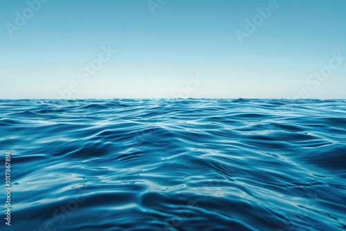 Calm blue ocean waves under a clear sky