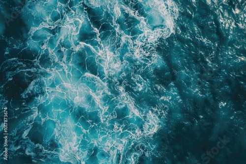 Aerial view of turquoise water with white foam