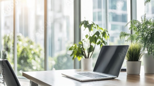 A bright, clean office space with a laptop on a desk, modern furniture, and large windows, creating a perfect minimalist business environment