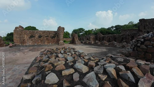 medieval structure amidst lush greenery at Feroz shah kotla fort, Delhi, India photo