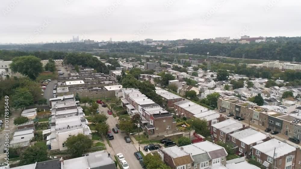 Aerial of Philadelphia Pennsylvania buildings and homes in East Falls neighborhood exposing the skyline Aerial of Philadelphia Pennsylvania buildings and homes in East Falls neighborhood exposing the skyline