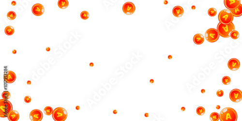 Vitamin A round capsules scattered randomly.