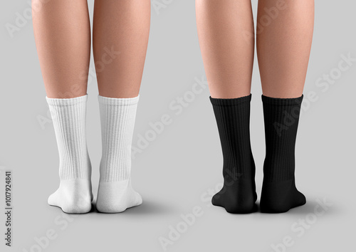 Mockup of black, white long socks with elastic band on slim female legs, back view, isolated on background with shadows. Set