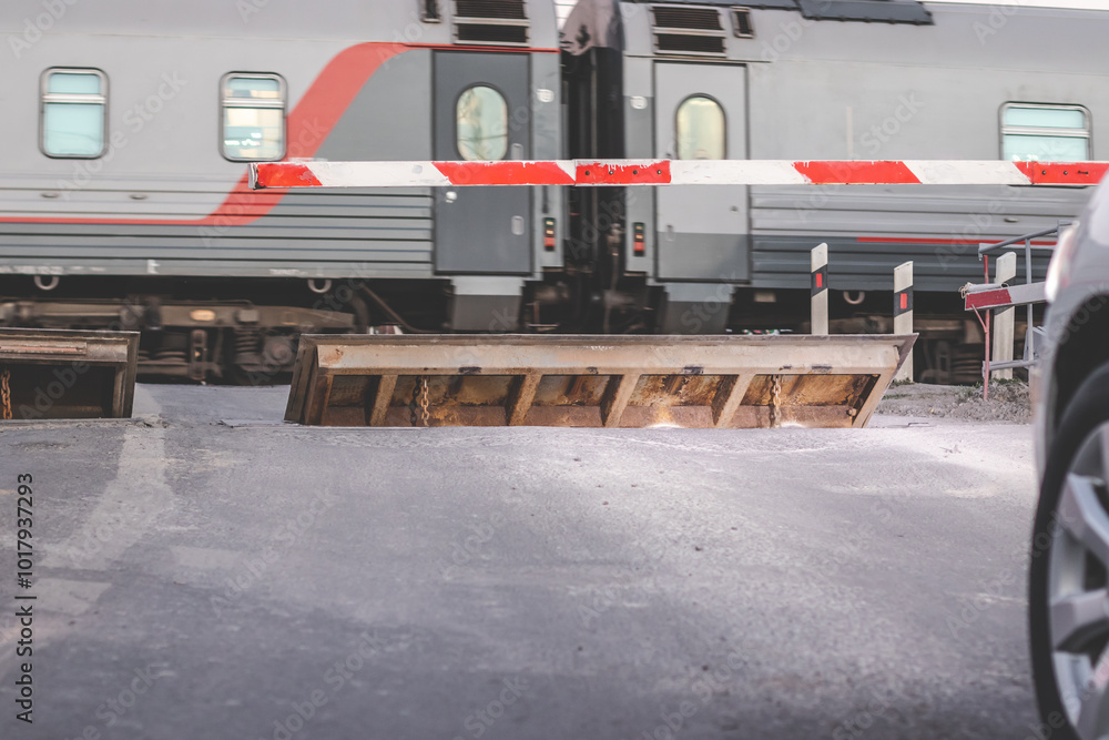 The railway crossing is closed . Barrier The railway crossing is closed . Barrier