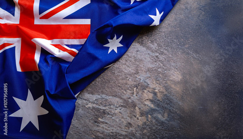 Happy Australia day. Australian flag against old grey stone background. 26 January. Australia day concept. Copy space. photo