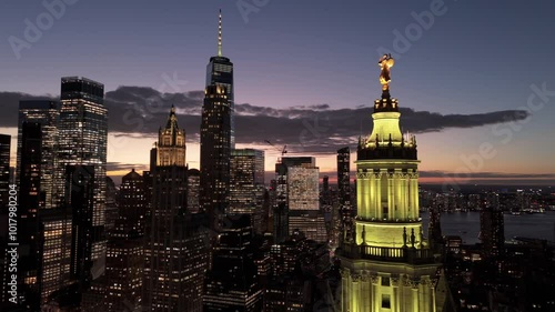 alt sunset flying counter clockwise around top of Municipal Building in NYC