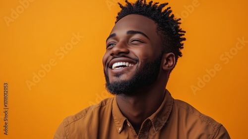 Portrait of a happy handsome man in a shirt with laughing