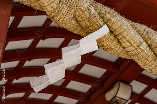 Close-Up of Shimenawa (Sacred Rope) with Shide (Paper Streamer) at Shinto Shrine Gate (Kamakura, Japan - August 2024) photo