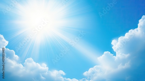 Bright white clouds scattered across a deep blue sky with rays of sunshine breaking through