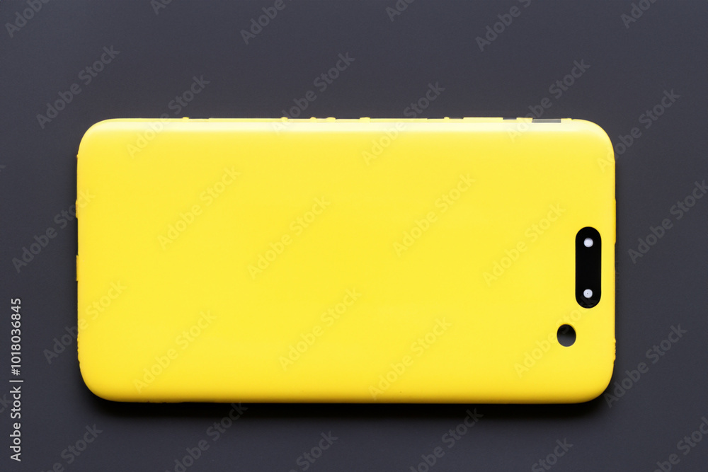 And yellow smartphone on white . mobile phone cellphone concept. a bright yellow and smartphone on a white. a bright and stylish smartphone on lifestyle a. And yellow smartphone on white . mobile phone cellphone concept. a bright yellow and smartphone on a white. a bright and stylish smartphone on lifestyle a.