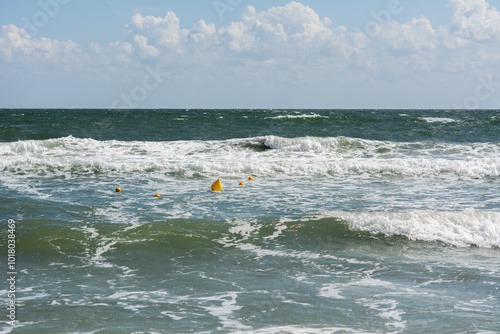 Yellow buoy on Black Sea seen from Mamaia seashore, Constanta, Romania