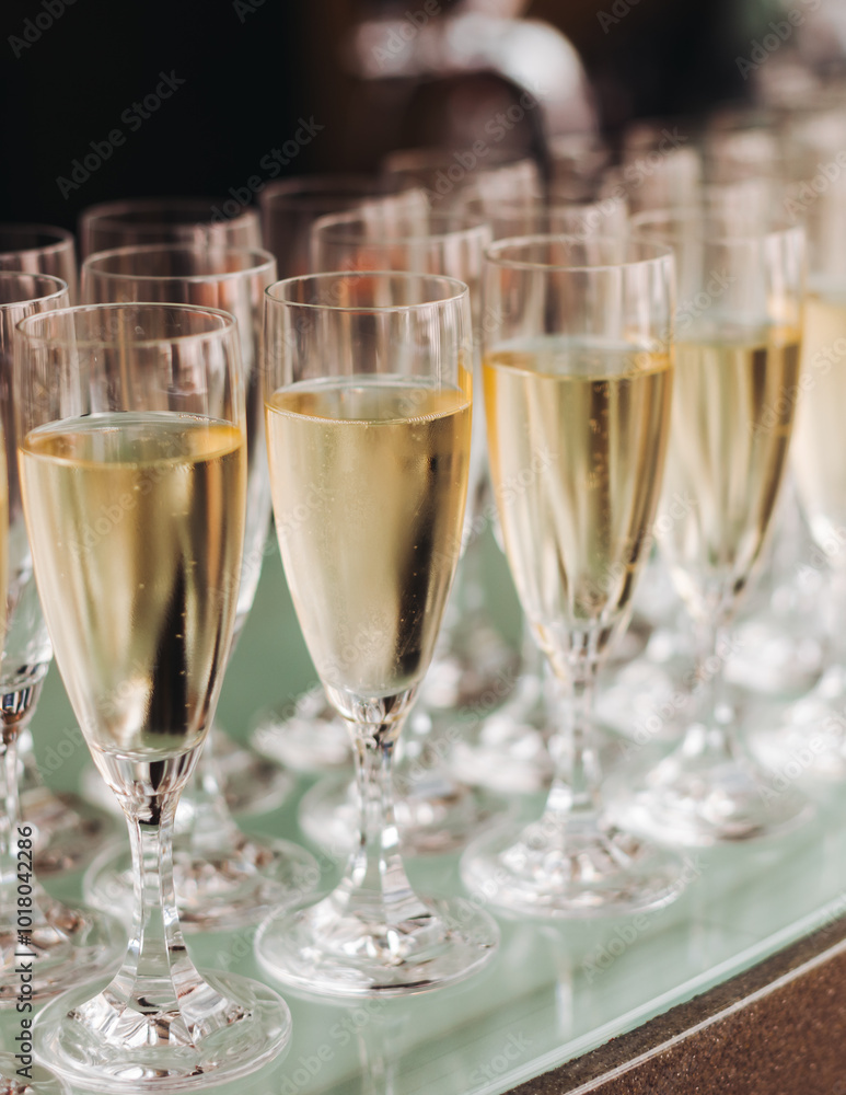 Alcohol setting on catering banquet table, bartender pouring liquor beverages, row line of different colored alcohol drinks on a party, glass of wine, sparkling wine on decorated banquet table event Alcohol setting on catering banquet table, bartender pouring liquor beverages, row line of different colored alcohol drinks on a party, glass of wine, sparkling wine on decorated banquet table event