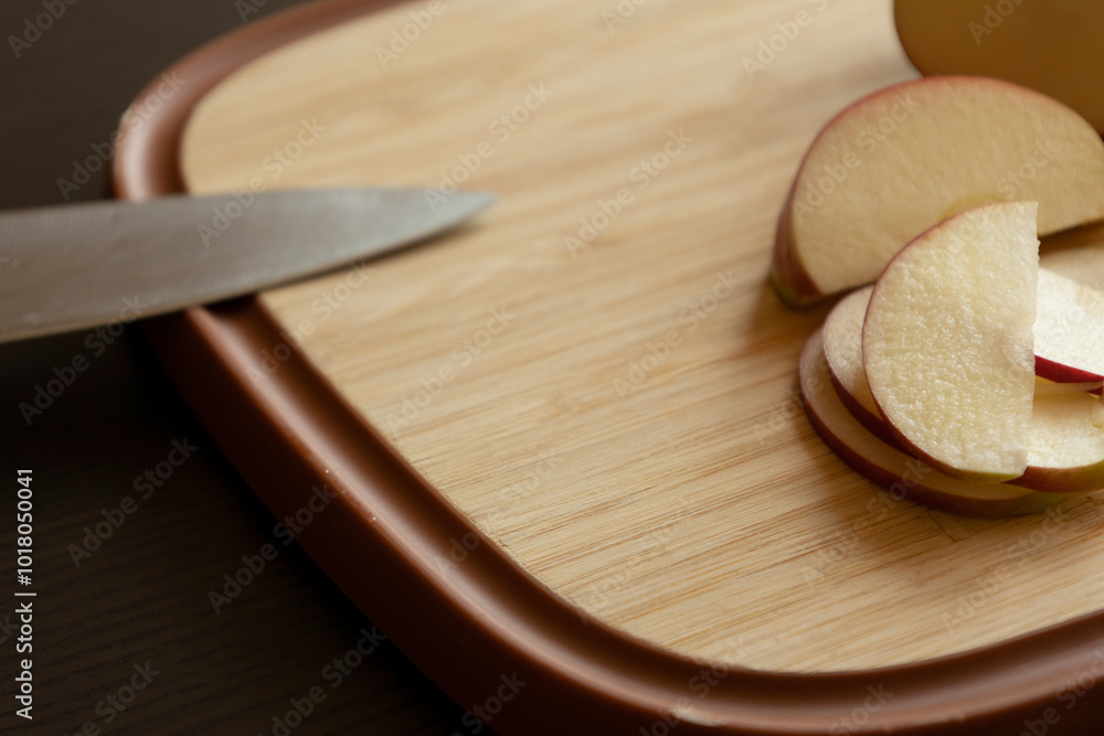 Slices of Apple on Wooden Cutting Board - Close-Up Slices of Apple on Wooden Cutting Board - Close-Up