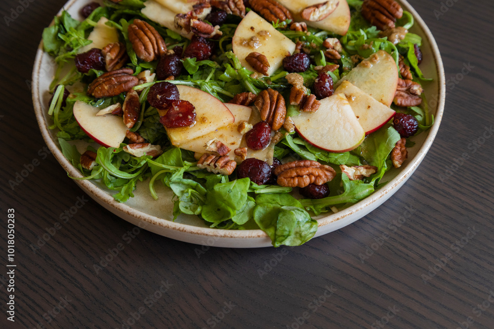 Fall Salad with Arugula, Apples, Cranberries, and Pecans - Close-Up Fall Salad with Arugula, Apples, Cranberries, and Pecans - Close-Up