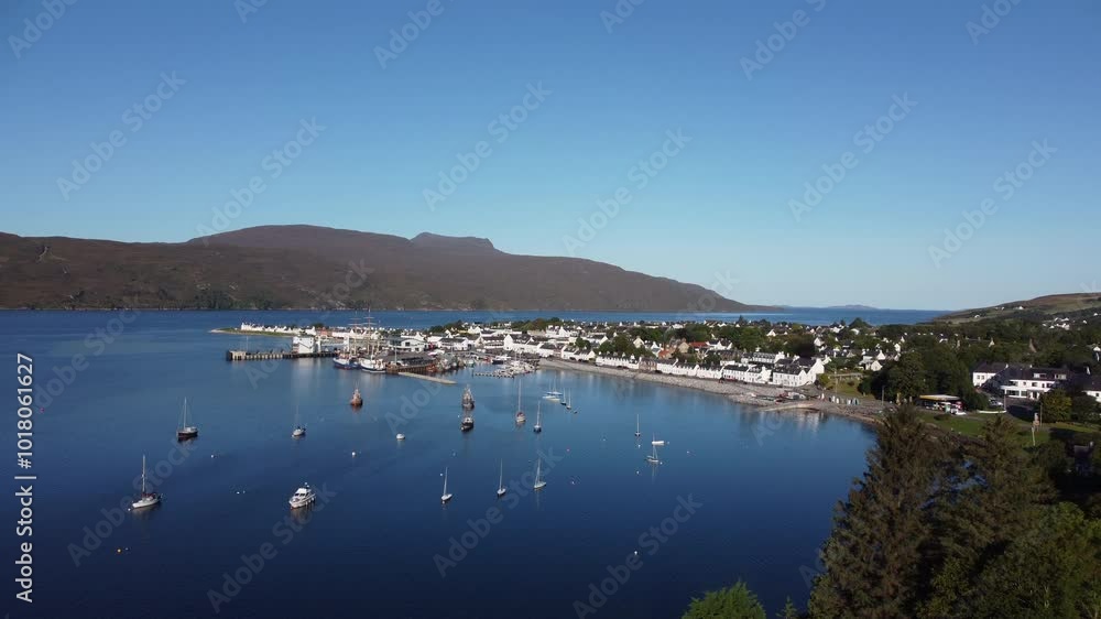 Take off drone shot of the docks at Ullapool, Scotland Take off drone shot of the docks at Ullapool, Scotland